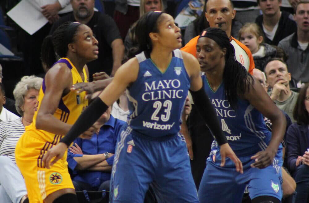 Maya Moore and Sylvia Fowles of the Lynx (right) and Nneka Ogwumike of the Sparks (left) during the 2016 WNBA Finals. (Credit: Wikimedia)