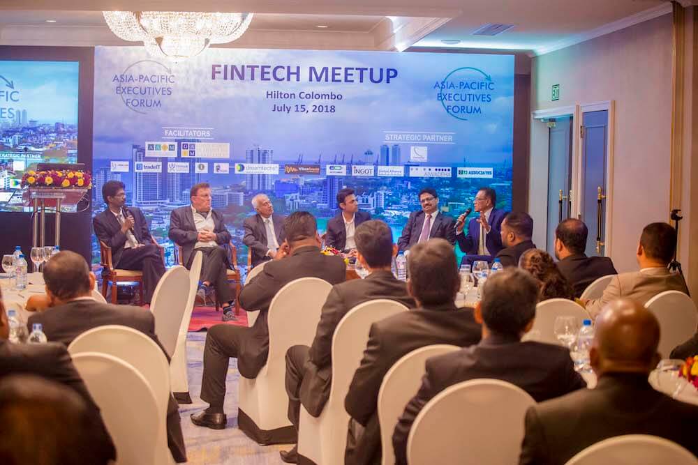 Fintech meetings, like this one in 2018, historically have all men in the room. (Credit: Wikimedia Commons)